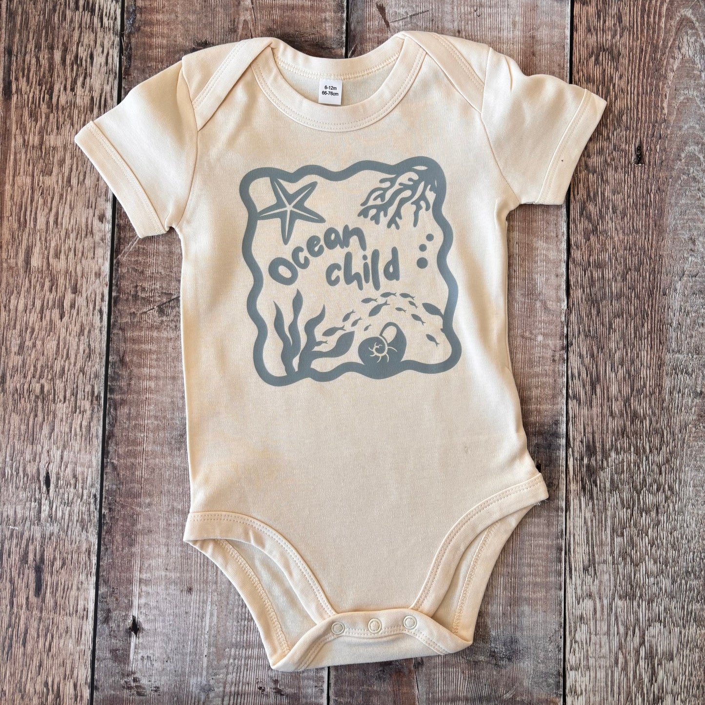 Ocean child (blue) short sleeve bodysuit 6-12m (natural)