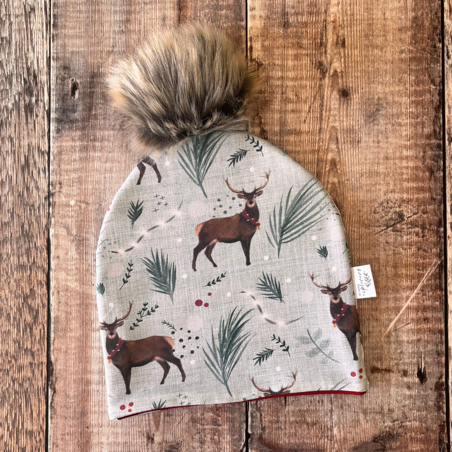 Blue Festive Stag Bobble Hat 1-2 years (wine inside)