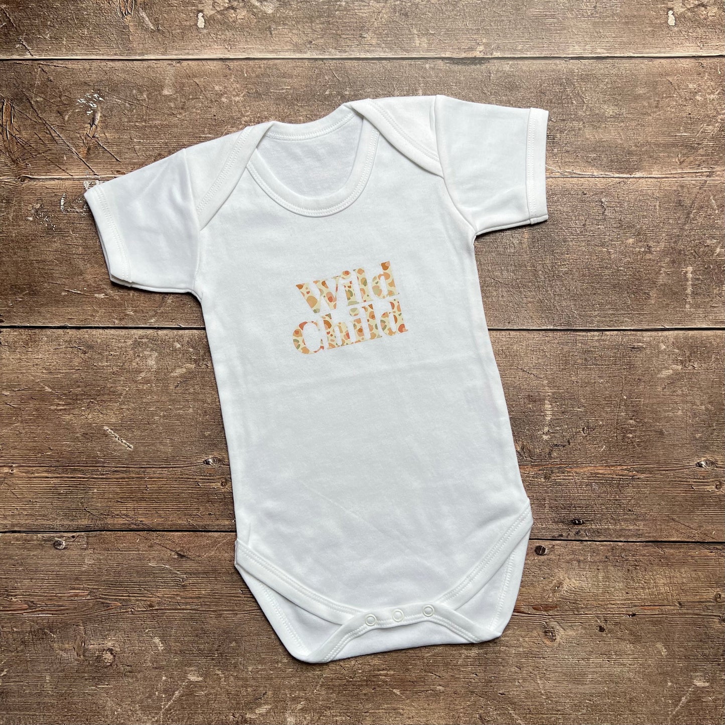Wild Child in leopard bodysuit 12-18m
