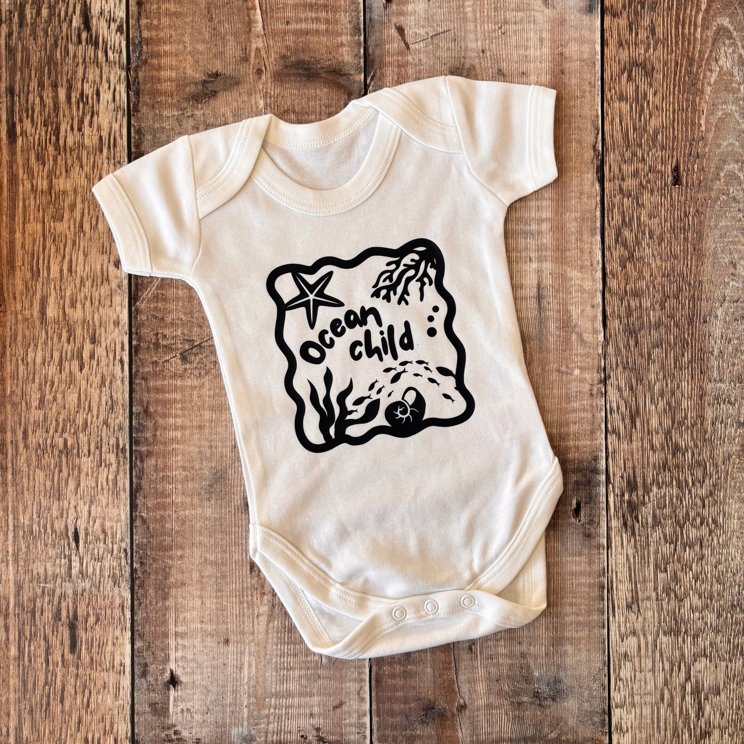 Ocean Child (navy) SS bodysuit 3-6m