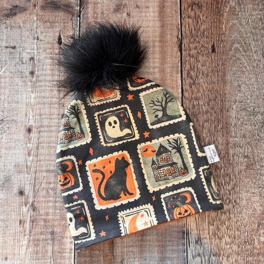Halloween Stamps Bobble Hat 2-4 years (terracotta inside)