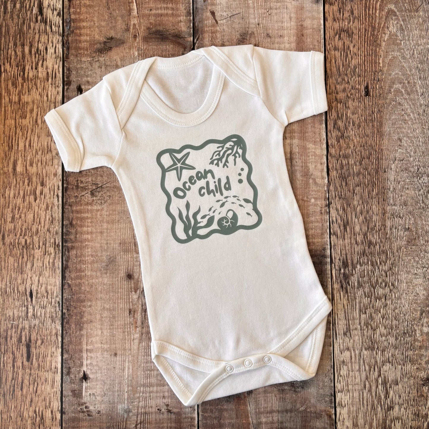 Ocean Child (blue) SS bodysuit 3-6m