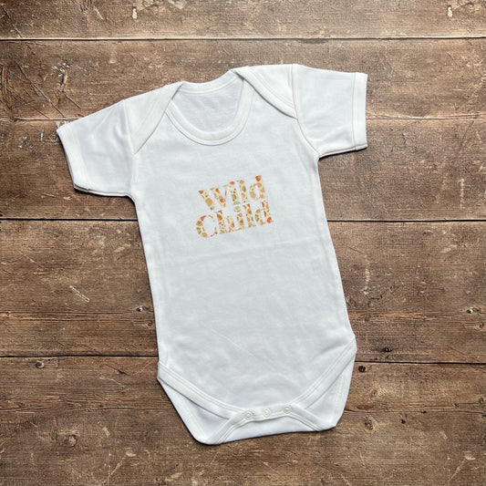 Wild Child in leopard bodysuit 3-6m